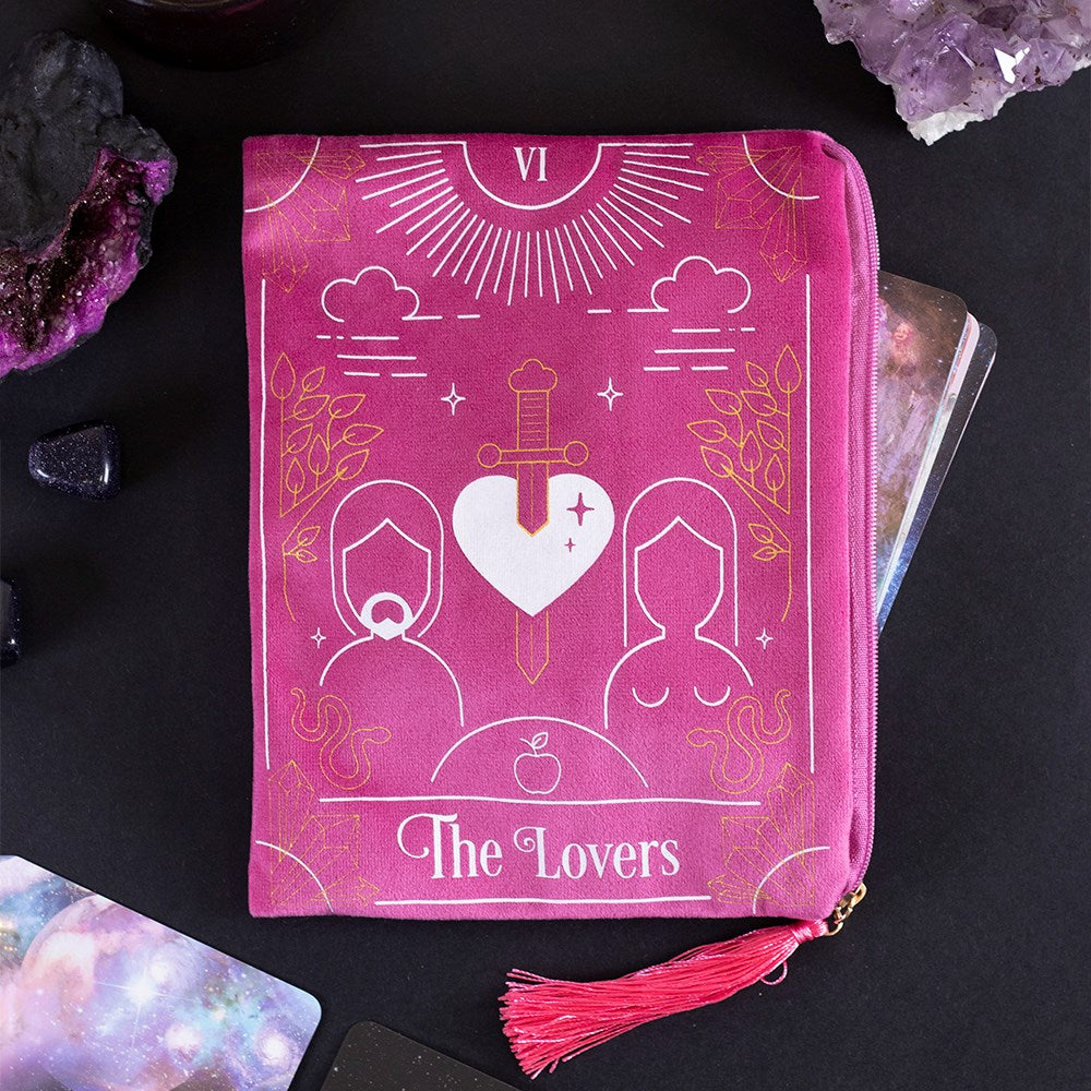 This velvet zipper pouch is the perfect place to keep tarot decks, crystals, beauty products and other treasures. Features a stunning white and gold lovers tarot card illustration on the front and a matching tassel and gold heart charm on the zipper. Size: H: 15cm x W: 20cm x D: 0.75cm Material: Polyester