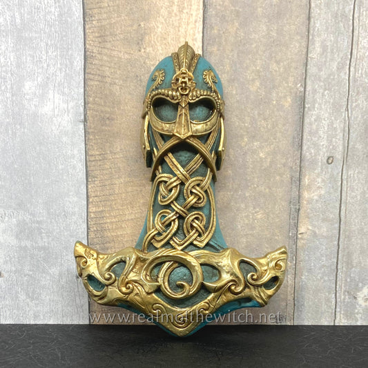 A beautifully decorated Thor's mighty hammer or Mjolnir commanding the primal energy of the storm. Cast resin decorative wall mount, hand painted and finished.  Dimensions (approx.): Approx. height 21cm.