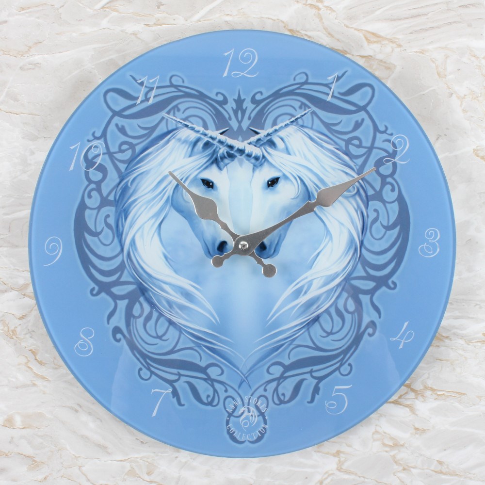 Beautiful Glass Clock by licensed artist Anne Stokes.  Features the Unicorn Heart design.  Clock is 34cm Diameter and requires 1 x AA battery not included.  Clock comes in a designed presentation box.  Glass material makes the design vibrant and bright.  Dimensions 34cm