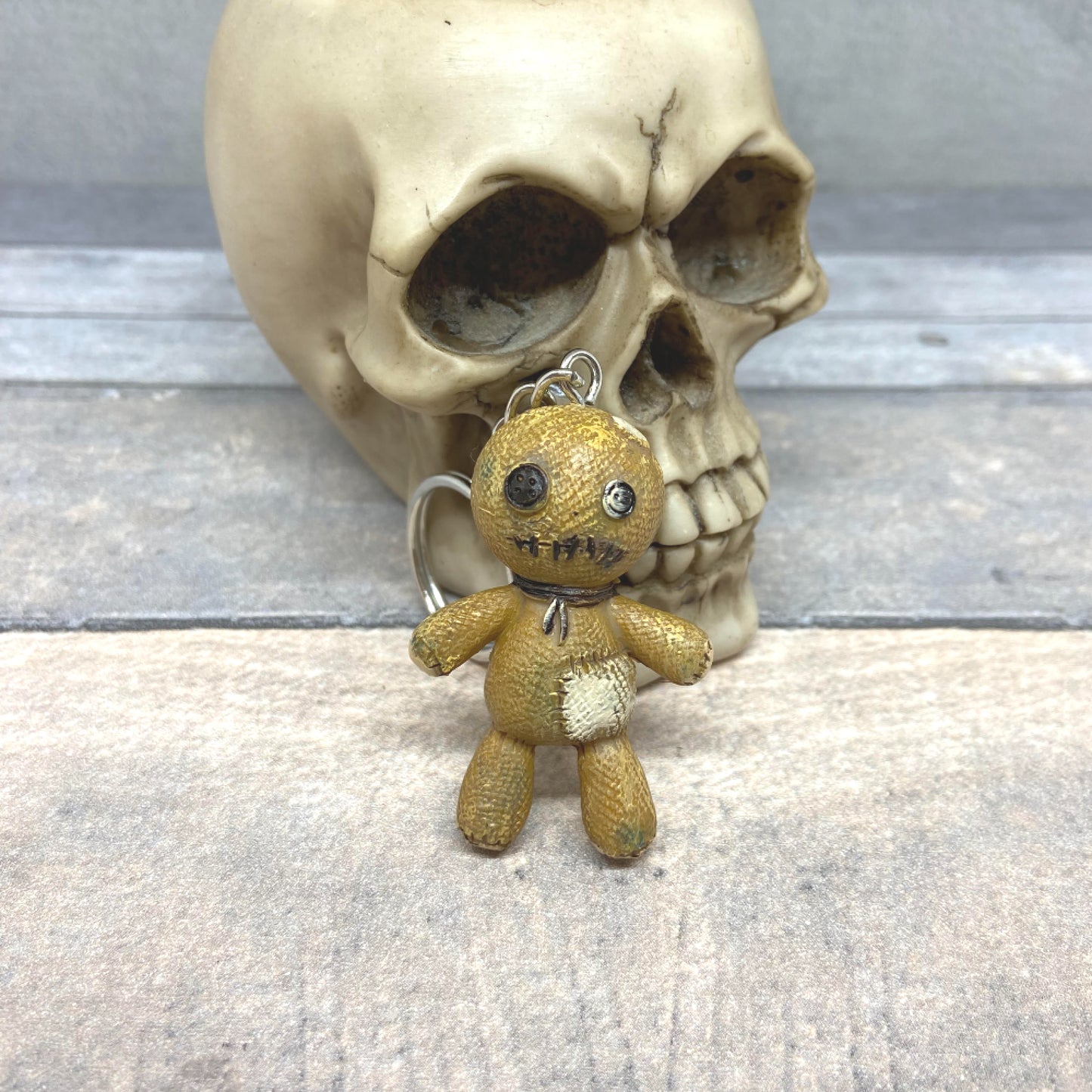 These cute little resin voodoo doll keyrings have buttons for eyes, a stitched mouth and a body covered with patches. A fun little addition to your set of keys or to hang from your purse or wallet.  Size: 6cm