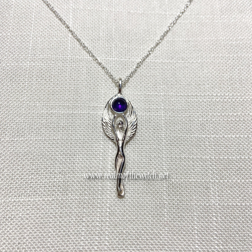 Set in 925 silver, this gorgeous Goddess reaches her arms above her head to hold an amethyst cabochon. Her wings then envelope the outside of the gemstone. She measures 4cm long (inc bale) x 1.3cm wide. All pendants come supplied on a 20" Sterling Silver Curb Chain and are gift boxed. This necklace is also available with a Rainbow Moonstone cabochon.