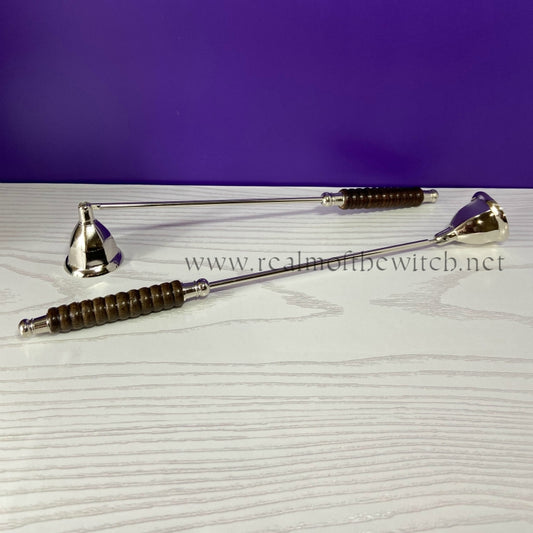 This silver coloured, metal hexagonal shaped candle snuffer with wooden handle is a useful implement to use in all your magical workings where candles are used. It saves blowing the candle out and won't leave blown wax marks on surrounding areas. Simply place the snuffer over the candle flame and wait for a few seconds before removing it. 